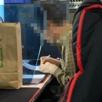 some young-forty (cringe middle-aged guy) writing erotica at a pc cafe